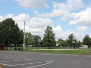 Scamahorn Park parking lot and basketball court